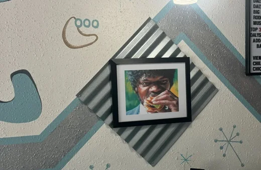 Eclectic pop-culture art on the wall inside Daly's retro diner